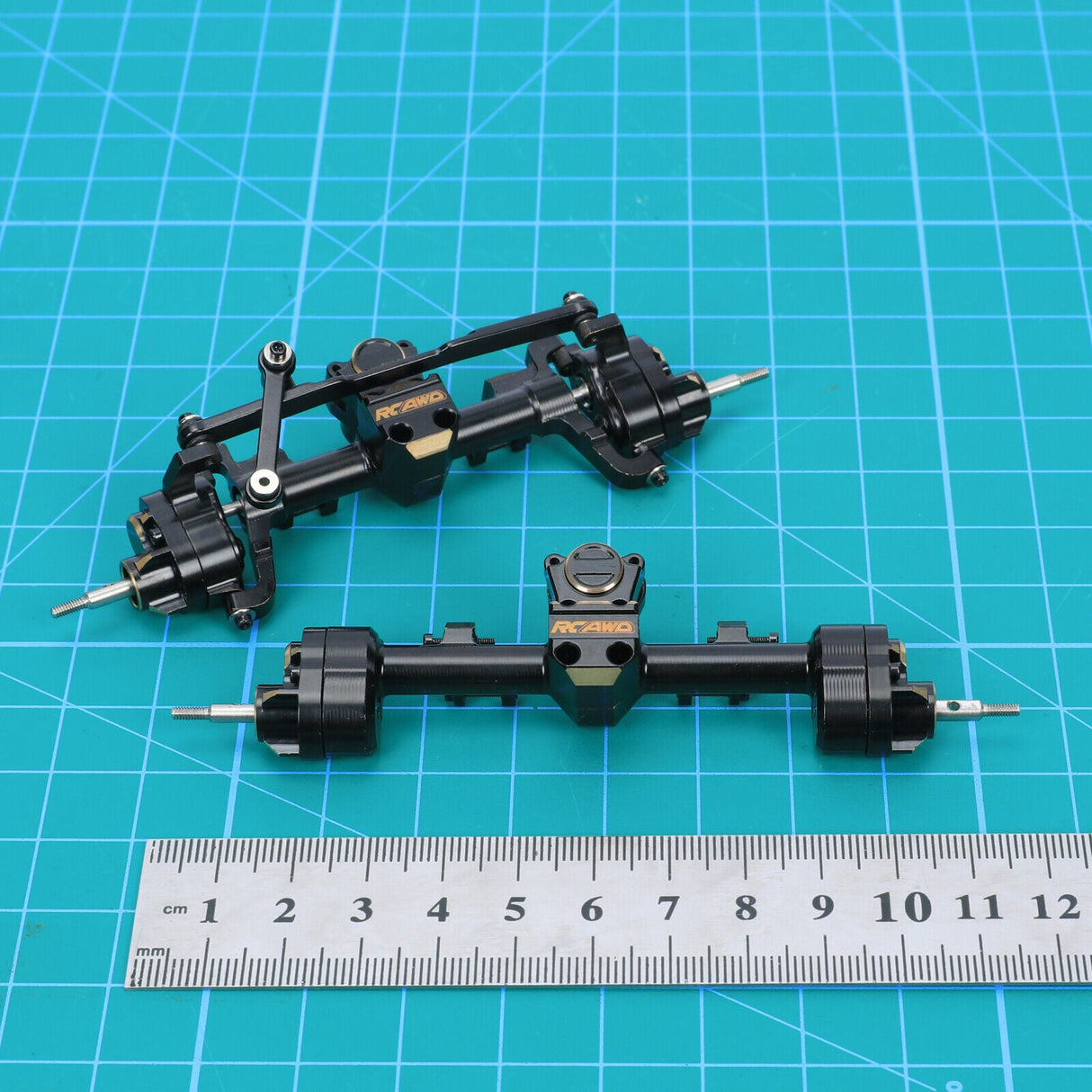 SCX24 F&R Brass Portal Axles w/ Brass Steering Link & Wheel Weights - TRC-145